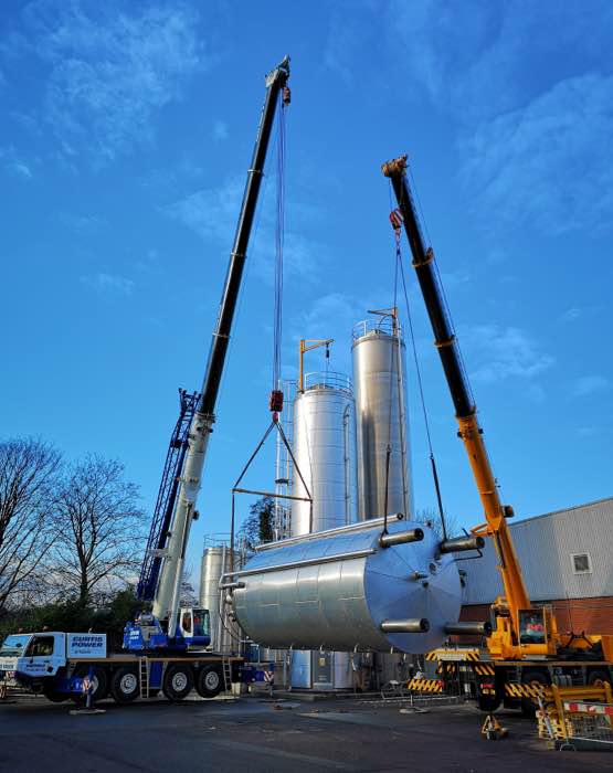 Curtis Power cranes doing a top and tail silo lift